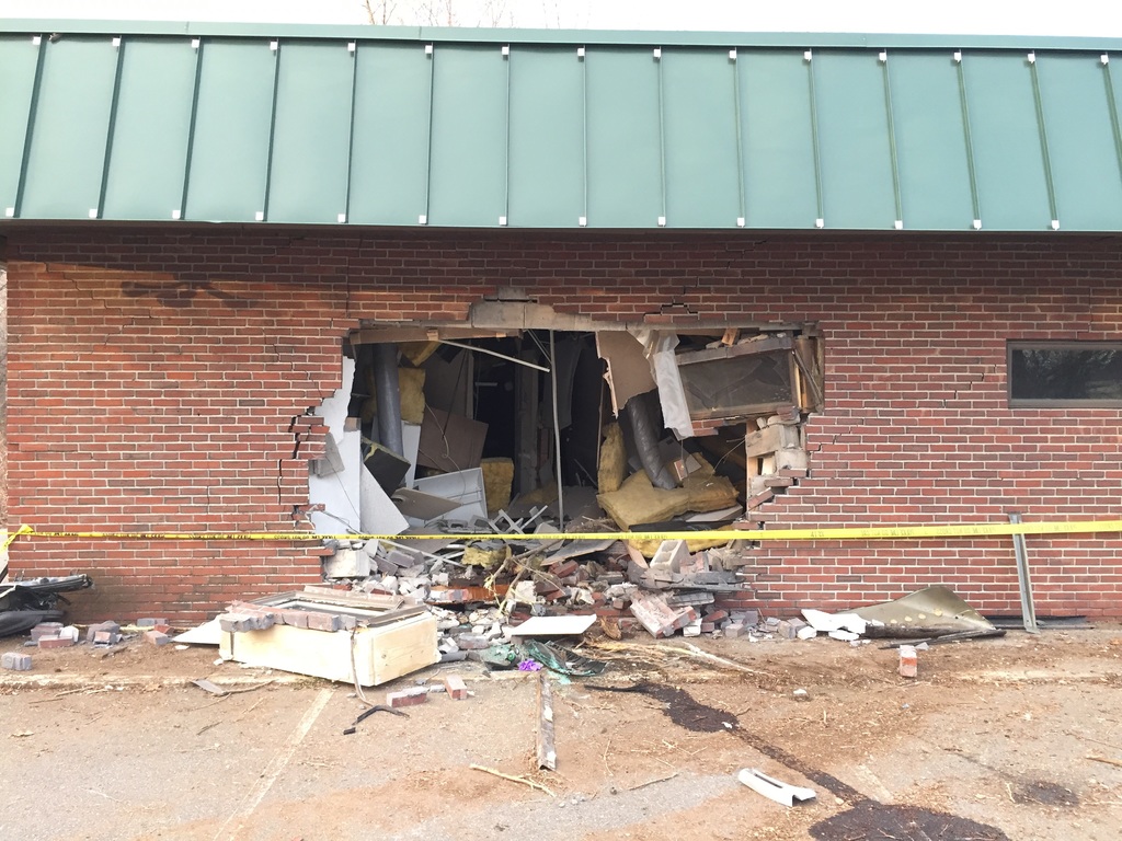 Teen driver crashes into building, pulled from wreckage